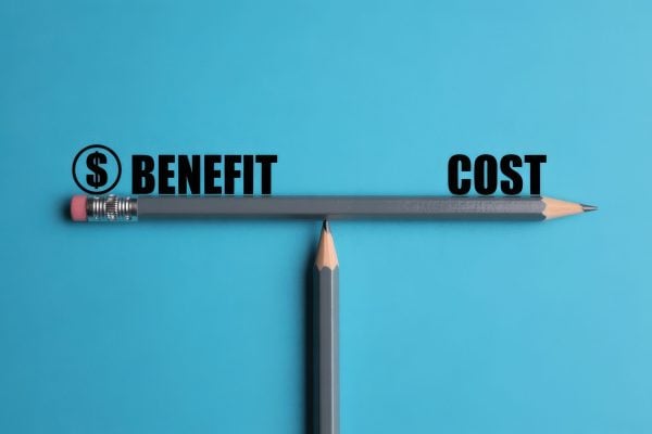 Balancing benefit and cost. scale made from pencils. AI generated image.